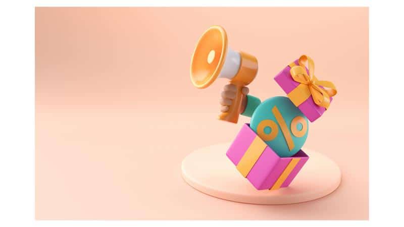 Une boîte à cadeau avec des offres spéciales tenant un mégaphone sur un fond rose.